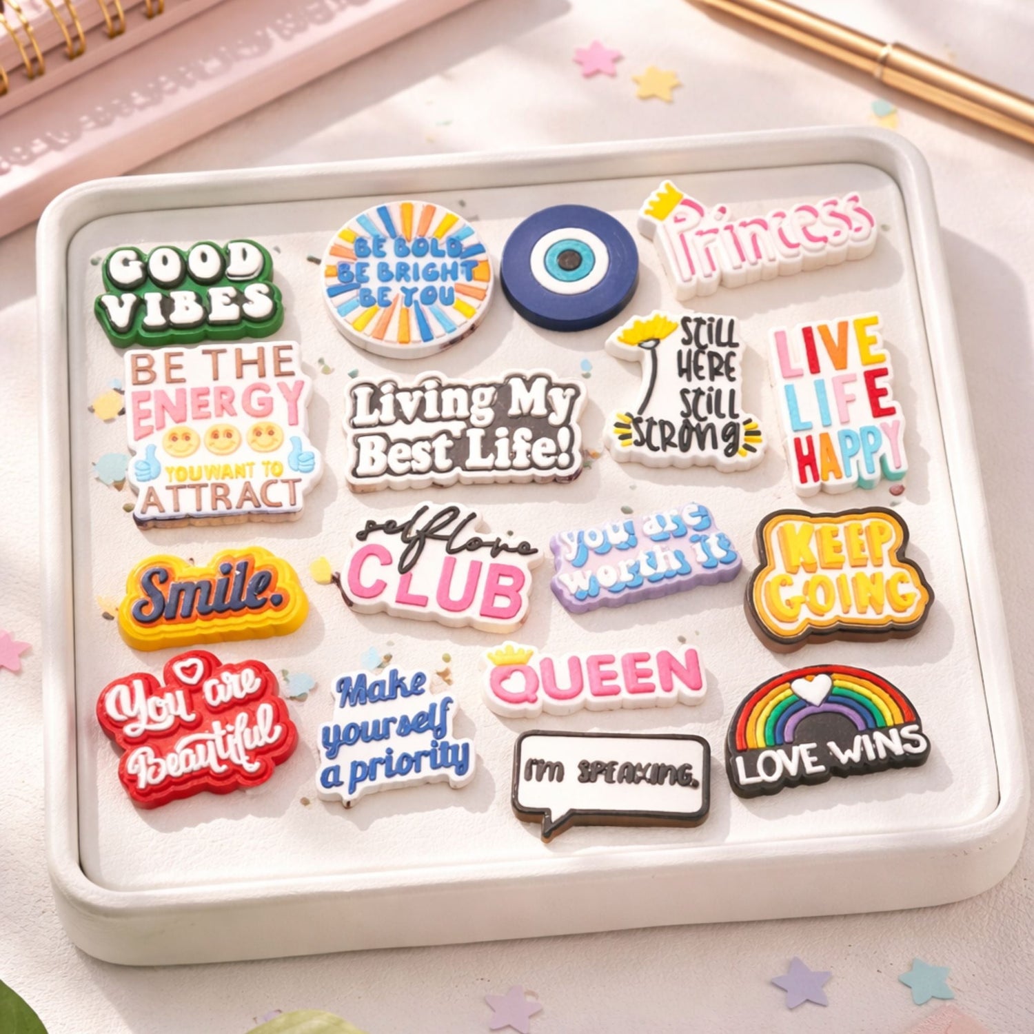 Positive and Colorful Croc/Shoe Jibbitz silicone shoe charms with positive affirmations and motivational sayings displayed on a tray