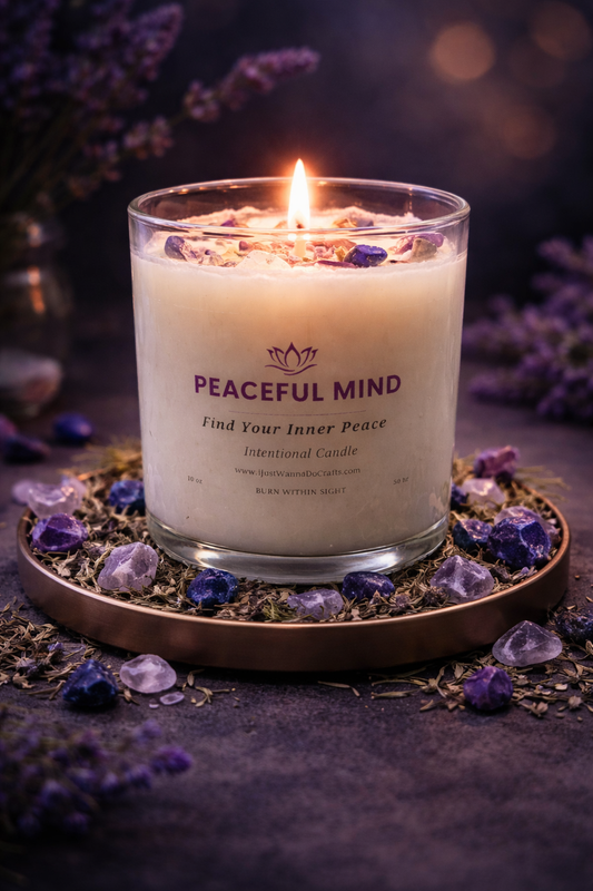 Peaceful Mind intentional crystal candle lit in glass jar with calming lavender tones and crystals